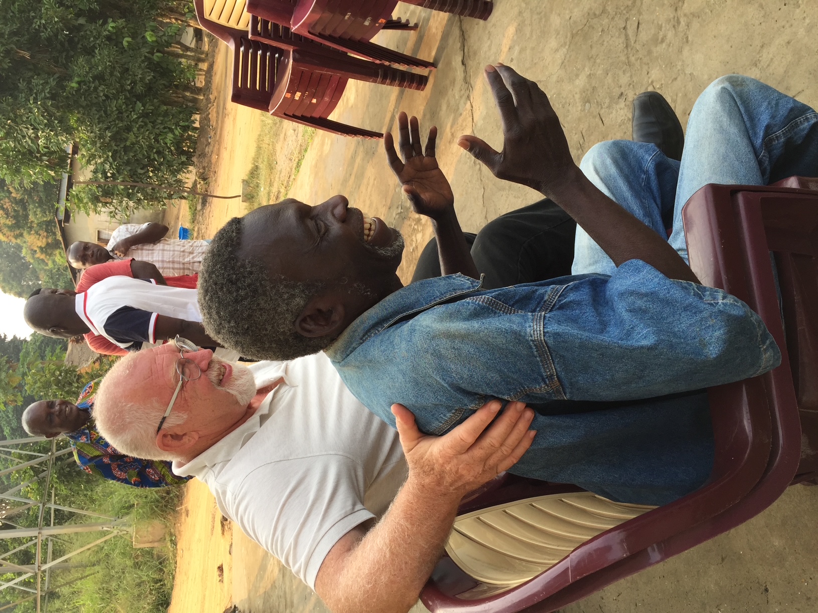 Geir Helge Ommundsen laughing with a friend in Congo